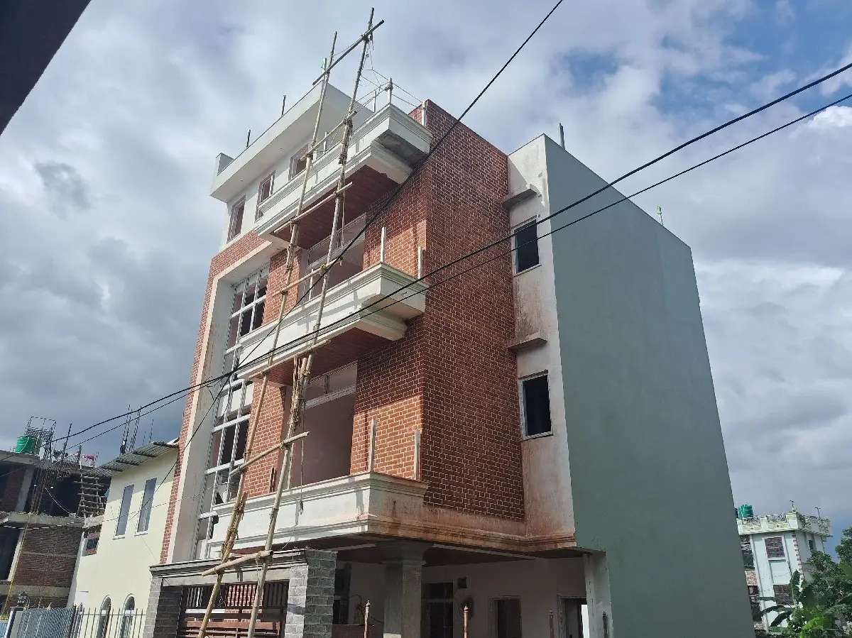 Brick & Glass Residence: Brick and glass residential building under construction by HNG, image 1 of 2