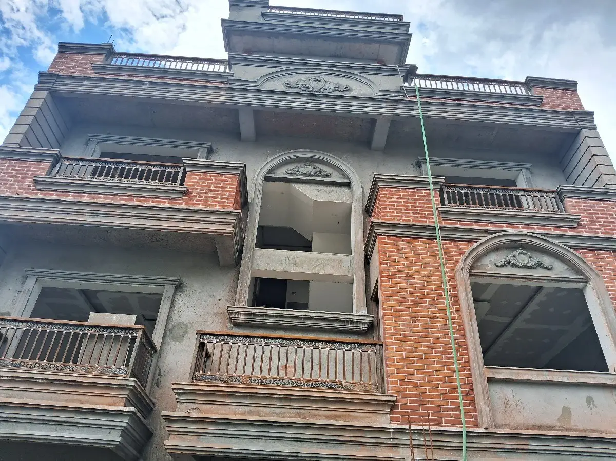 Arched Brick Residence: Brick residence with arched openings, built by HNG in Nepal, image 1 of 2