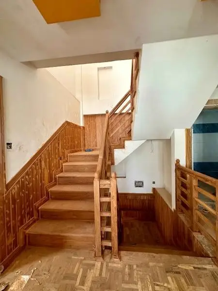 Brick Residence with Timber Interiors: Brick-clad residence with timber stair and interiors, built by HNG, image 4 of 4